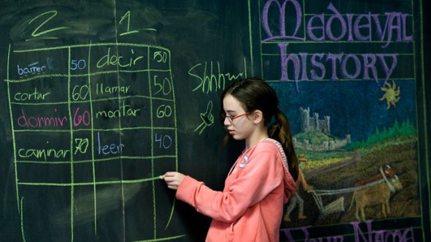 Nina Auslander-Padgham, a sixth-grader at Washington Waldorf School, works on a blackboard not an interactive whiteboard.