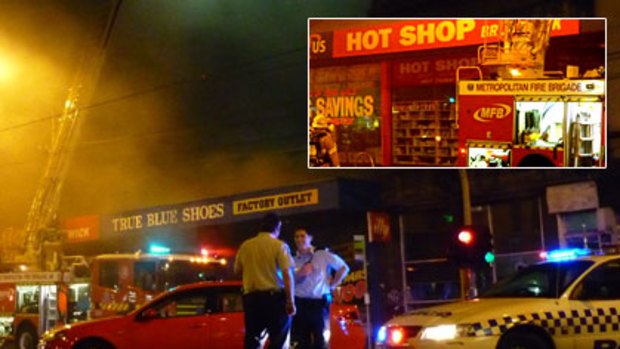 Smoke drifts across Sydney Road in Brunswick after a blaze that is believed to be suspicious.