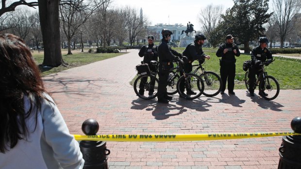US Secret Service officers in the cordoned-off Lafayette Park on Sunday after a security incident at a White House checkpoint on Saturday.
