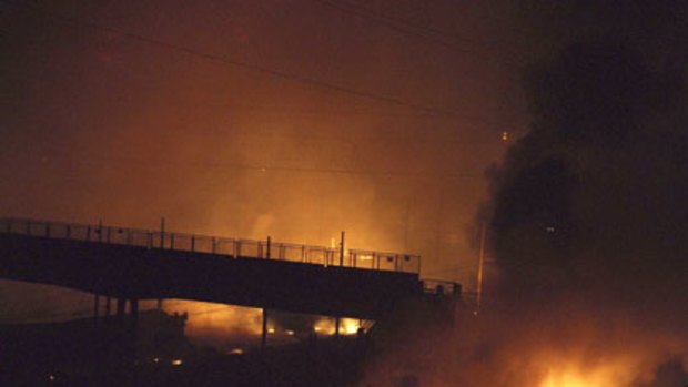 Flames engulf area where a freight train derailed and two cars filled with gas exploded in northern Italy.