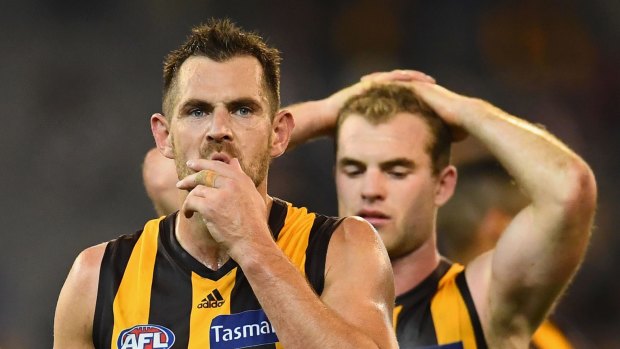 Luke Hodge says the mindset of the Hawks after their 2013 premiership differed significantly from that after they won in 2008.