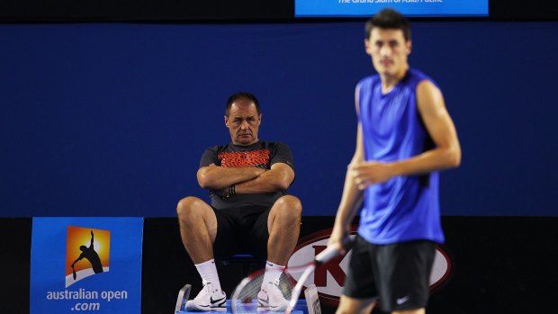 Bad reputation: Bernard Tomic's father John watches him during a practice session prior to the 2012 Australian Open at Rod Laver Arena.