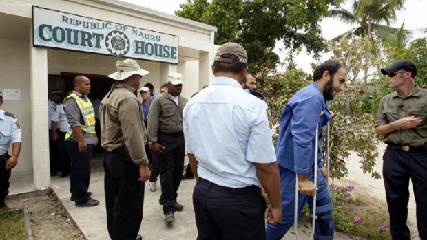 Asylum seekers attend the Nauru court to face charges of unlawful damage.