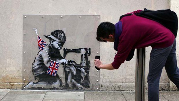 For sale ... the Banksy mural, <i>Slave Labour</i>, created on a wall in North London is scheduled to be sold in Miami this week.