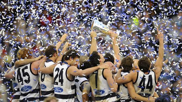 Geelong players celebrate after winning the 2009 grand final.