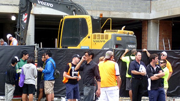 Workers walked off a Perth building site today in protest at the underpayment of their Chinese colleagues.