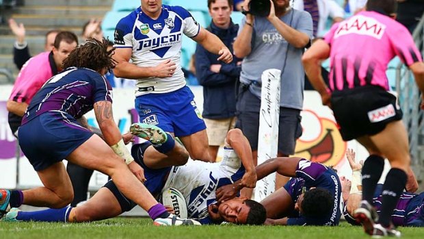 Over again: Canterbury's Tim Lafai scores one of his side's eight tries against the Storm.