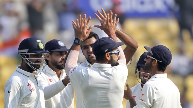 Spinner's paradise: India celebrate another wicket to Ravi Ashwin.