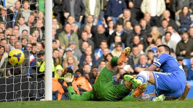 Late drama: Chelsea skipper John Terry reacts as Everton's Tim Howard scores an own goal in injury to hand the Blues victory.