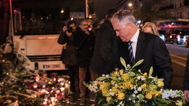 Australian Prime Minister Malcolm Turnbull lays a wreath.