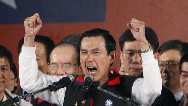 Victorious ... Ma Ying-jeou celebrates his re-election as president on Saturday, a result welcomed by China and the US.