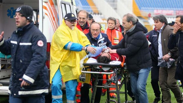 Died on his way to hospital ... Livorno midfielder Piermario Morosini is wheeled away on a stretcher.