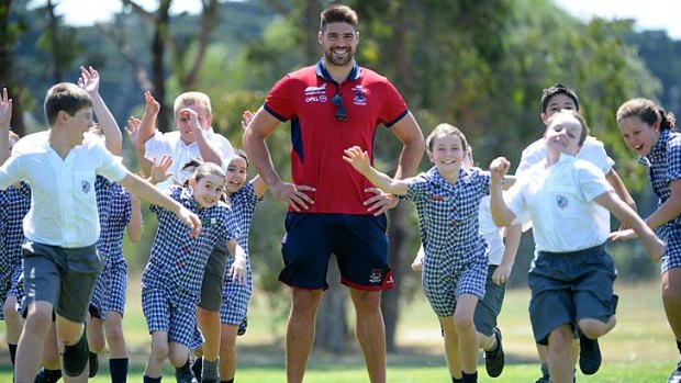Standing tall: New Demon Chris Dawes was king of the kids at Casey Grammar school on Tuesday.