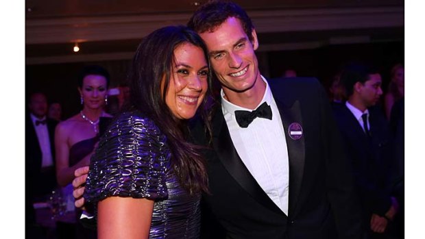 Women's singles winner Marion Bartoli of France poses with Andy Murray at the winners ball.