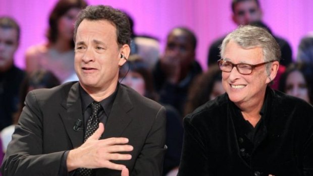 German born US film director Mike Nichols (right) and actor Tom Hanks answer questions on French television as they promote <i>Charlie Wilson's War</i> in Paris in 2007.