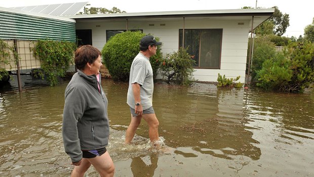 David Taylor and wife Christine assess the situation at their Tallygaroopna home.