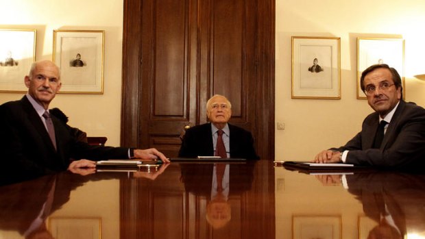 Former Greek Prime Minister George Papandreou (left) with President Karolos Papoulias (centre) and Antonis Samaras (right) at the Presidential Palace in Athens earlier this month.