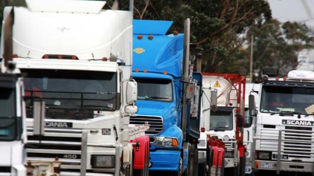 Cars and trucks do battle on the approaches to the Westgate bridge on the Westgate Freeway.