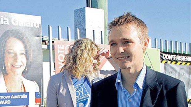 Wyatt Roy, the Liberal Nationals candidate for the seat of Longman in Queensland, hands out leaflets at a polling booth yesterday. <i>Picture: Michelle Smith</i>