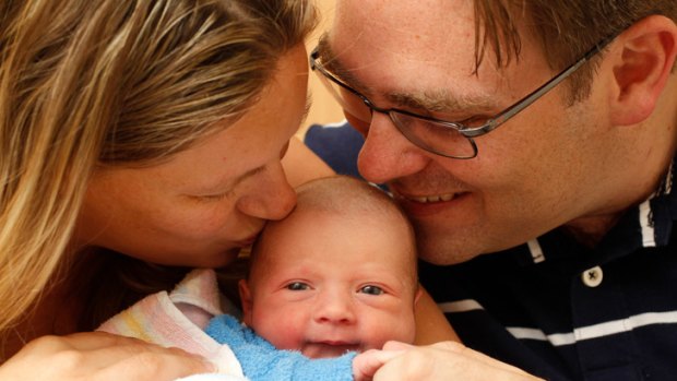 Welcome addition &#8230; Jo and Jeremy Geale with Zavier, the first baby born in NSW this year.