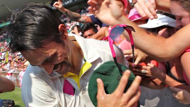 It's all good: Mitchell Johnson joins in the fun with fans at the SCG.