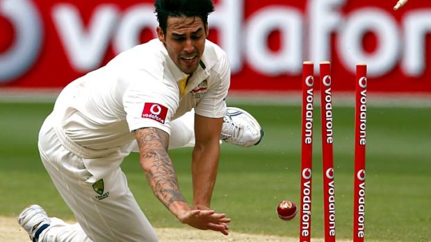 Horror start ... Mitchell Johnson runs out opener Dimuth Karunaratne for one run during the first over of Sri Lanka's second innings.