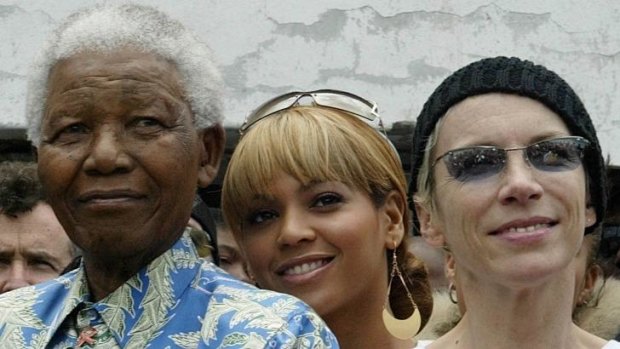 Nelson Mandela, from left, with  US singer Beyonce Knowles and British singer Annie Lennox on Robben Island in Cape Town.