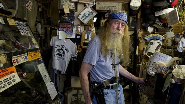 Trigger figure ... Dent Myers, above, the outspoken owner of an American Civil War surplus stoer in Kennesaw.