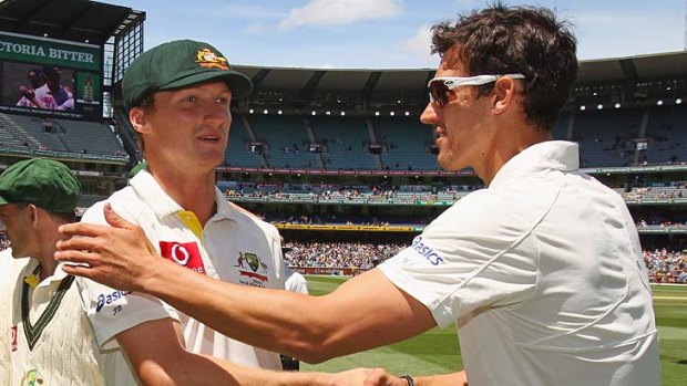 Jackson Bird is congratulated by Mitchell Starc after Australia won the Second Test at the MCG.