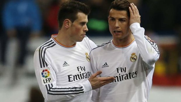 Cristiano Ronaldo is consoled by Gareth Bale after being struck by a lighter.