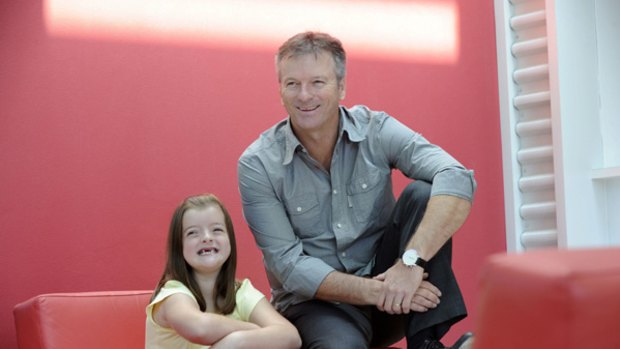 Rare find … Alysha Edwards, who has a rare bone disease, with cricket great Steve Waugh at the Children's Hospital at Westmead yesterday.
