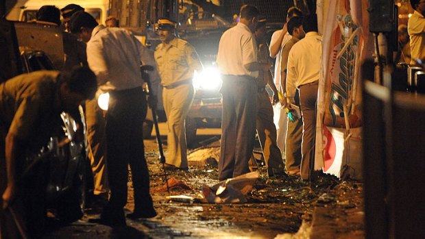 Police at one of the blast sites in Mumbai.