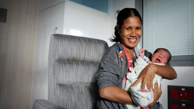 Life-saving ... Lelia De Jesus Andrade with baby Reinaldy, whose care was provided by Rotary.
