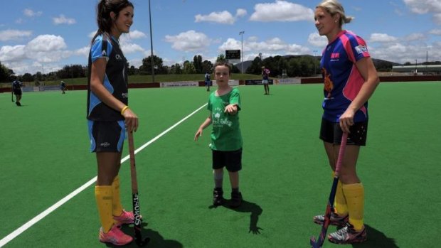 Canberra's Hockeyroos players Anna Flanagan, left, and Edwina Bone, return for the Strikers in this year's Australian Hockey League.