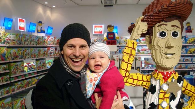 Baby on board ... Barry Divola and Coco in toy heaven.