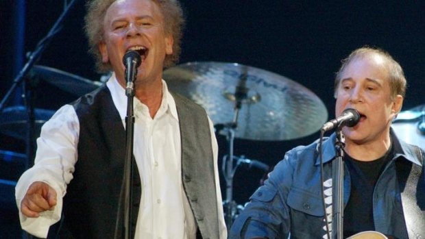 Art Garfunkel and Paul Simon perform together in a 2003 concert. 