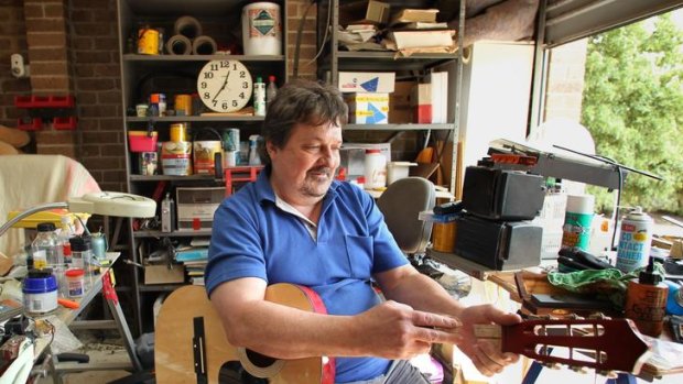 Self-confessed hoarder Chris Prestwich with a garage full of junk.