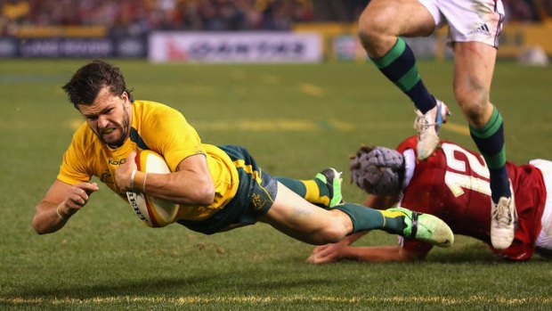 Adam Ashley-Cooper scores a try for the Wallabies against the Lions on Saturday night.