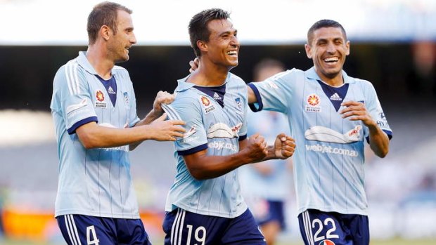 Better days: Nicky Carle, the centre of controversy this week, is congratulated by Ranko Despotovic and Ali Abbas after scoring against Melbourne Victory in round 16.