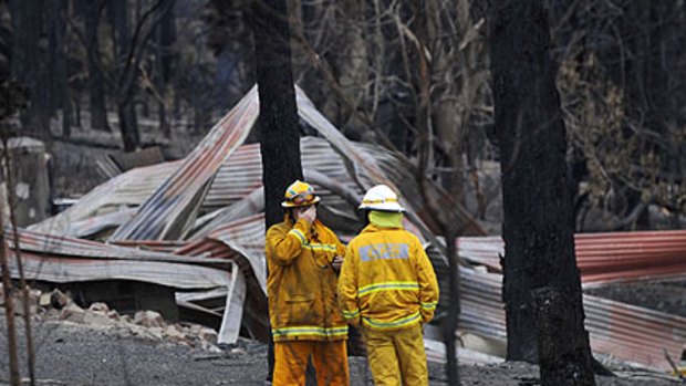 Firefighters inspect the devastation at Churchill.