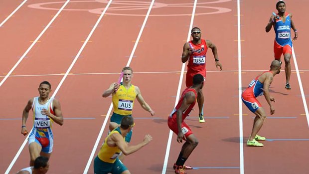 Ran with a broken leg ... Manteo Mitchell, back second right, prepares to hand over the baton to Josh Mance.