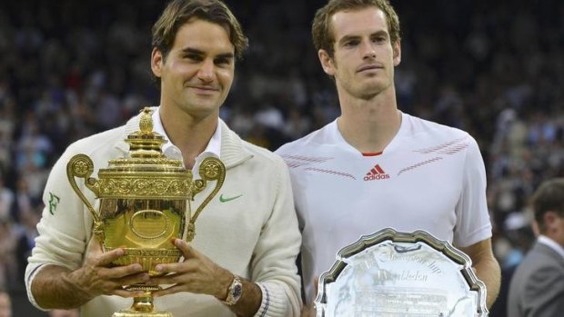 Captivating final ... Roger Federer, left, holds his trophy as runner-up Andy Murray stands by his side.