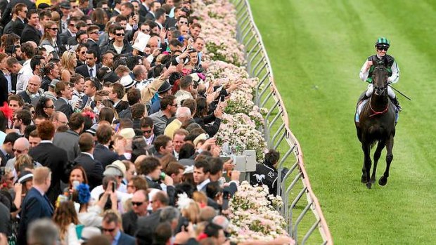 Shamus Award, Chad Schofield up, celebrates winning the Cox Plate at Moonee Valley.