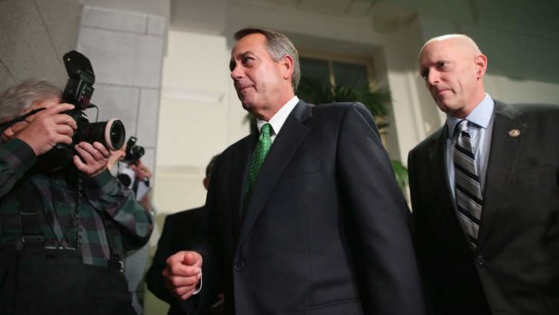 Speaker John Boehner (centre) after a meeting where Republicans discussed the controversial bill.
