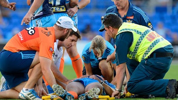 Head clash: the Titans' Ashley Harrison came off second best in a tackle by Manly's Richie Fa'aoso and will miss this weekend - the same time on the sidelines as that given to Fa'aoso.