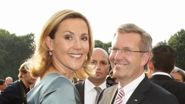 Towering presence ... Germany's president Christian Wulff with wife Bettina.