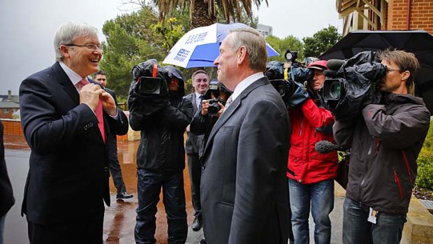 On the move again: Kevin Rudd catches up with WA Premier Colin Barnett in Perth.
