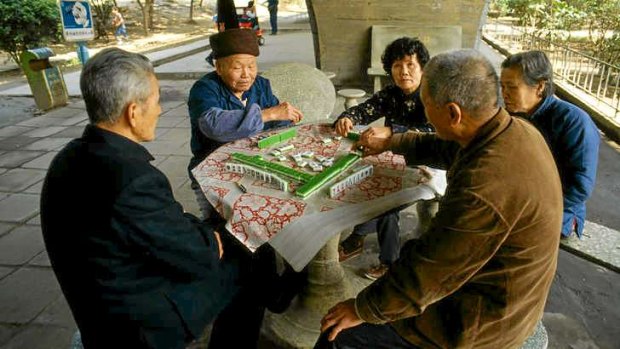 Playing mahjong is a popular pastime in Guangzhou.