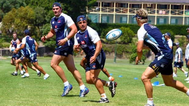 Running game ... Waratahs skipper Phil Waugh will be hoping his backline stars can form a lethal combination in this year's Super Rugby tournament.