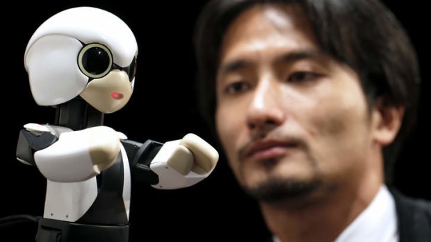 Tomotaka Takahashi, president of Robo Garage, demonstrates the Kirobo humanoid communication robot.